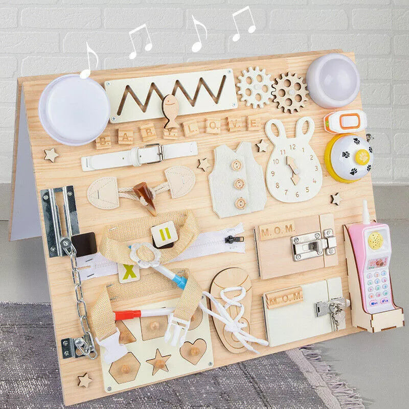 Wooden activity board with various educational items on a gray surface.