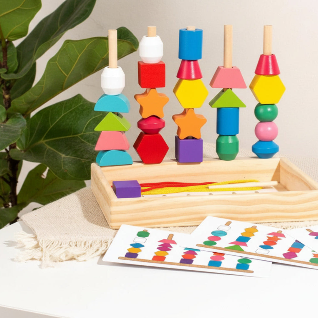 Colorful wooden educational toy with geometric shapes and matching cards on a neutral background