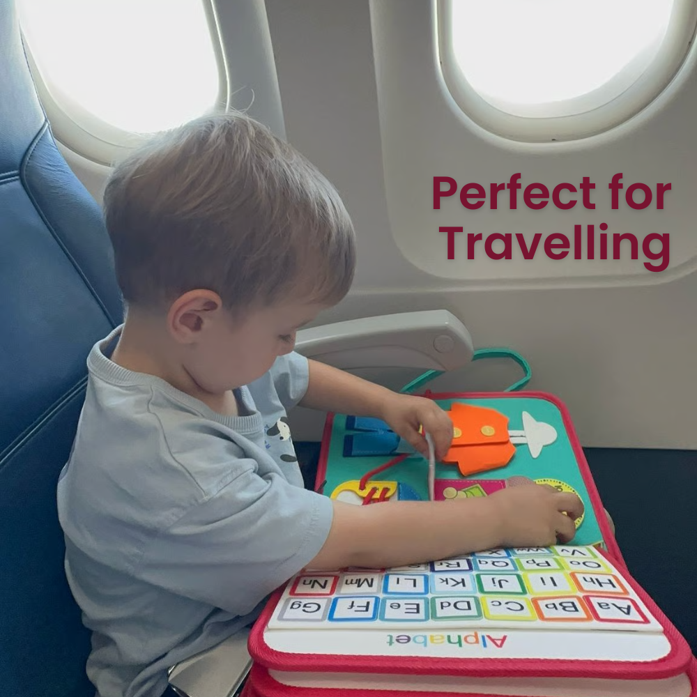 Child playing with a travel activity book on an airplane