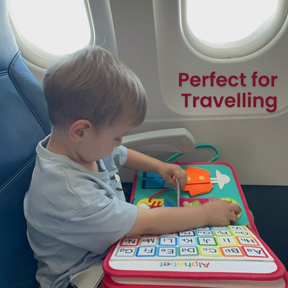 Child playing with a travel activity book on an airplane
